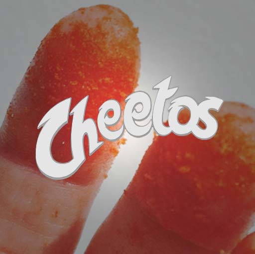 A person is holding their finger up to the cheetos logo.