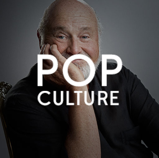 A man sitting in front of the words pop culture.
